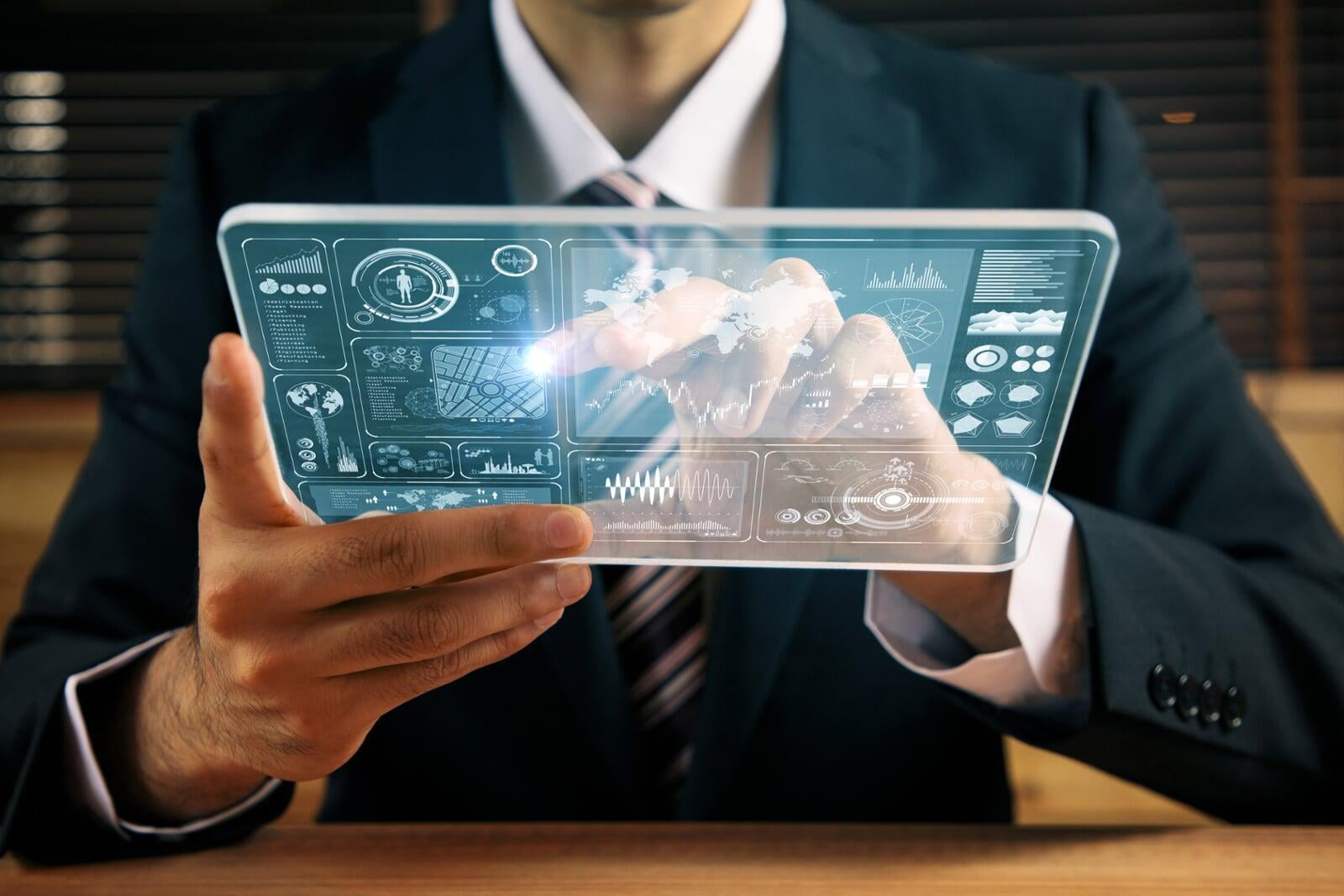 Person with clear tablet. Show the concept of Meerkat Technologies single pane of glass. 